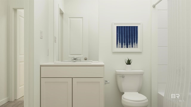 full bathroom featuring toilet and vanity