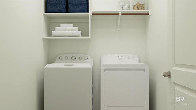 washroom with separate washer and dryer and laundry area
