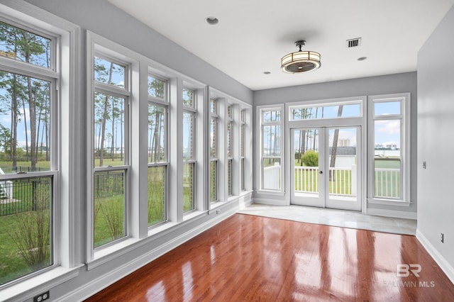 unfurnished sunroom featuring plenty of natural light