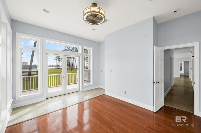 doorway to outside featuring french doors and hardwood / wood-style floors