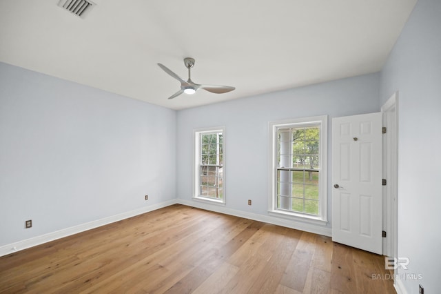 unfurnished room with light hardwood / wood-style flooring and ceiling fan