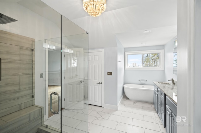 bathroom with plus walk in shower, a chandelier, vanity, and tile patterned floors