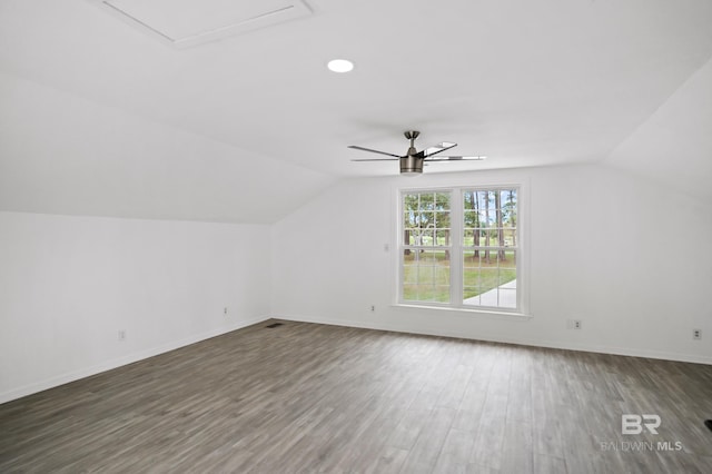 additional living space with hardwood / wood-style floors, ceiling fan, and lofted ceiling