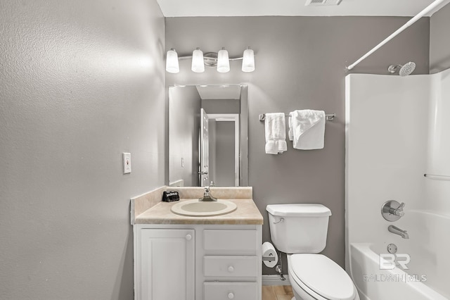 full bathroom with vanity, toilet, and bathtub / shower combination