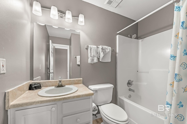 full bathroom with vanity, toilet, and shower / tub combo with curtain