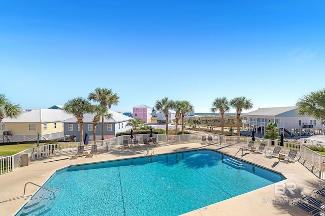 view of swimming pool with a patio