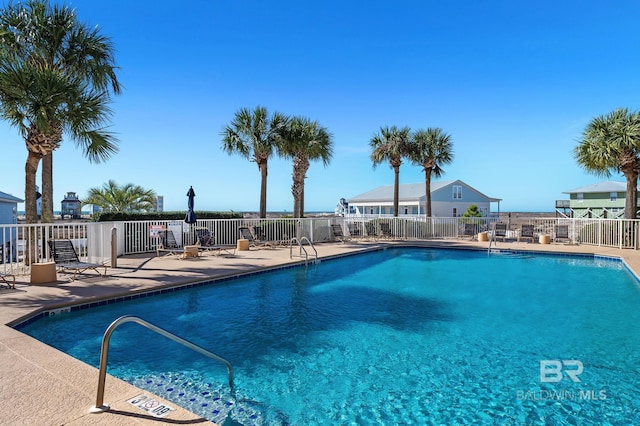 view of swimming pool with a patio