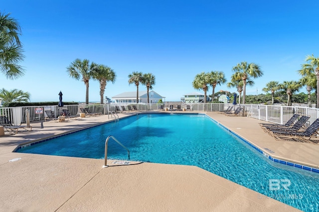 view of swimming pool with a patio