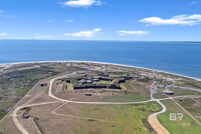 drone / aerial view featuring a water view and a view of the beach