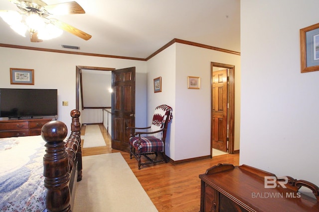 bedroom featuring light hardwood / wood-style flooring and ceiling fan