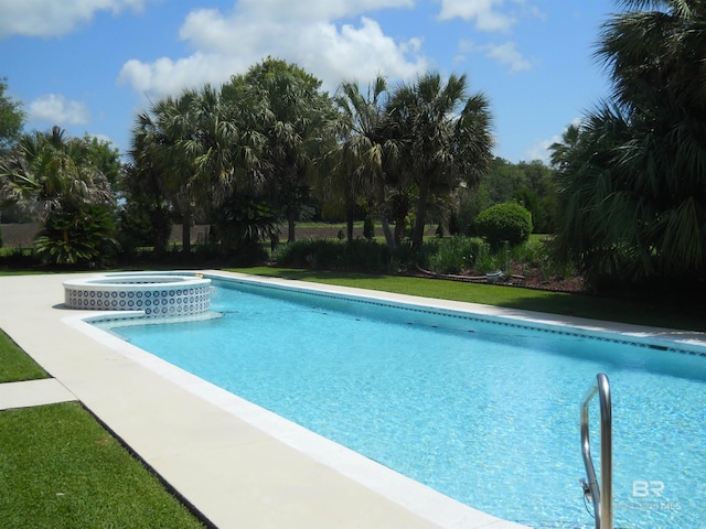 view of swimming pool featuring an in ground hot tub