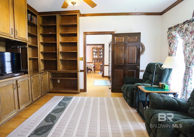 interior space featuring light hardwood / wood-style floors, crown molding, and ceiling fan