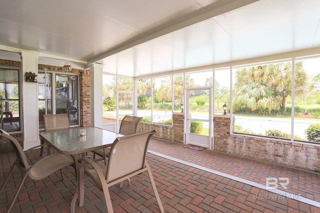 sunroom / solarium featuring a wealth of natural light