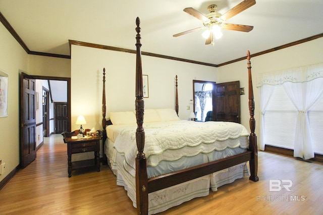 bedroom with ceiling fan, hardwood / wood-style flooring, and ornamental molding