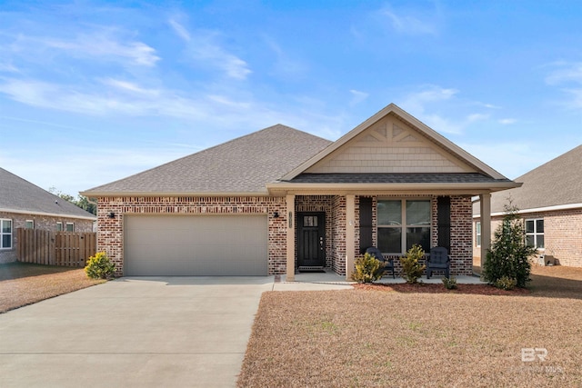 view of front of property featuring a garage and covered porch