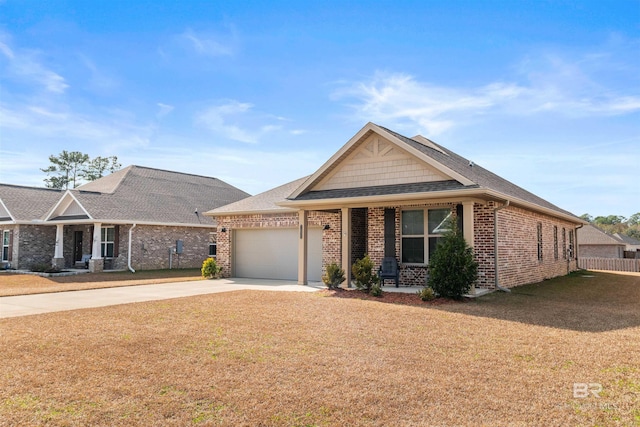 view of front of house featuring a garage and a front lawn