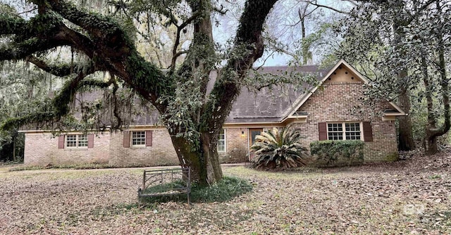 view of front of house with brick siding