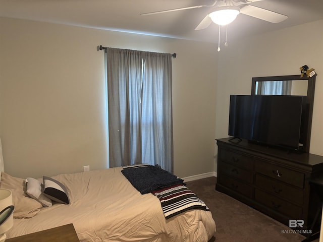 bedroom featuring dark colored carpet and ceiling fan