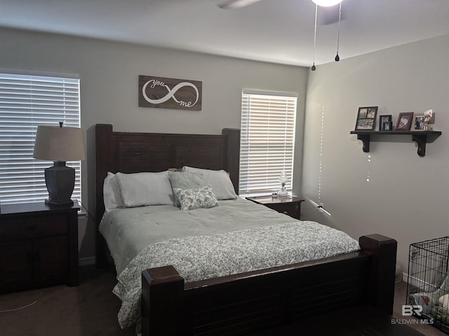 bedroom with ceiling fan and dark hardwood / wood-style floors