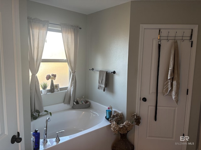 bathroom featuring a tub to relax in