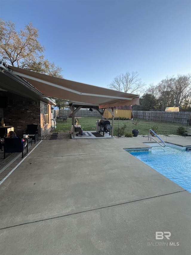 view of pool featuring a fenced in pool, a yard, a fenced backyard, and a patio