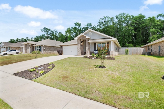 2526 E Windmere Dr, Semmes, AL 36575 - view of front of house featuring brick siding, concrete driveway, central AC, an attached garage, and board and batten siding