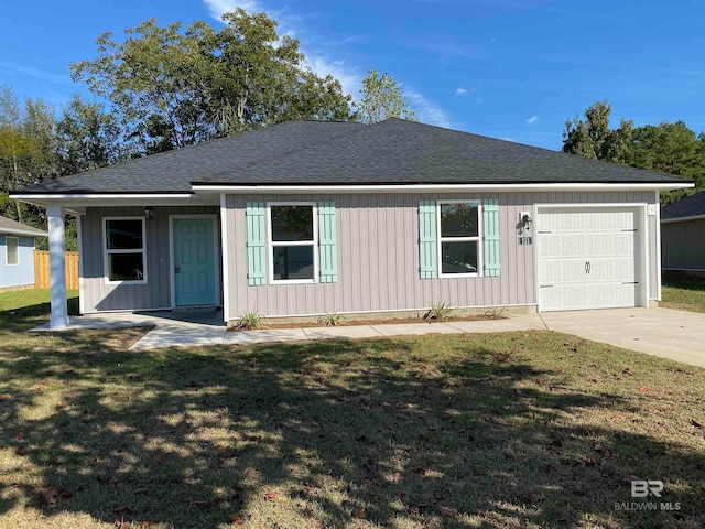 single story home featuring a garage and a front yard