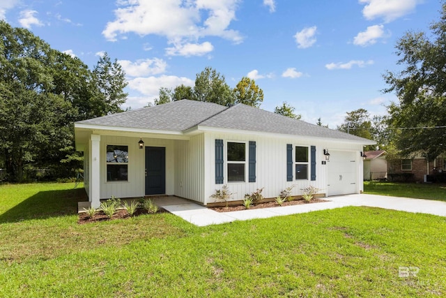 ranch-style house featuring a garage and a front yard