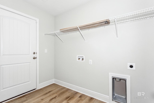 laundry area with wood-type flooring, electric dryer hookup, and washer hookup