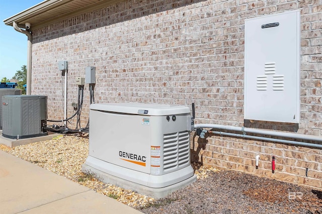 exterior details featuring central AC unit, a power unit, and brick siding