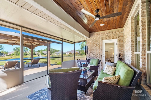 sunroom / solarium with outdoor lounge area, ceiling fan, and a wealth of natural light
