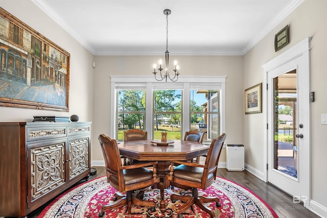 dining room featuring a chandelier, baseboards, crown molding, and dark wood-type flooring