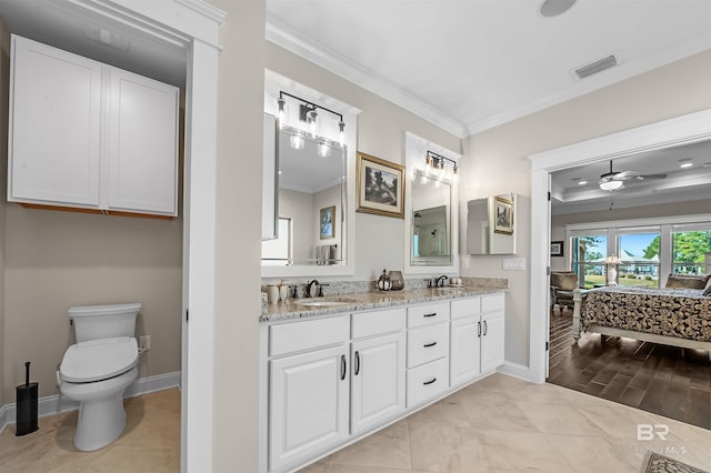 full bathroom featuring baseboards, visible vents, ornamental molding, and a sink