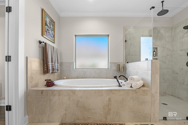 bathroom featuring a garden tub, crown molding, and tiled shower