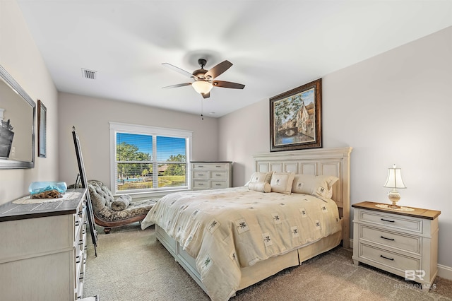 bedroom featuring visible vents, a ceiling fan, and carpet flooring