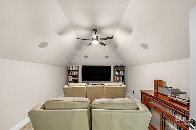 home theater featuring lofted ceiling, ceiling fan, carpet floors, and baseboards