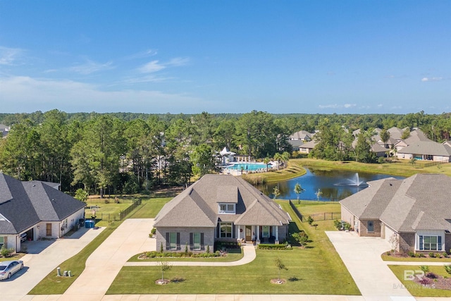 bird's eye view featuring a residential view and a water view