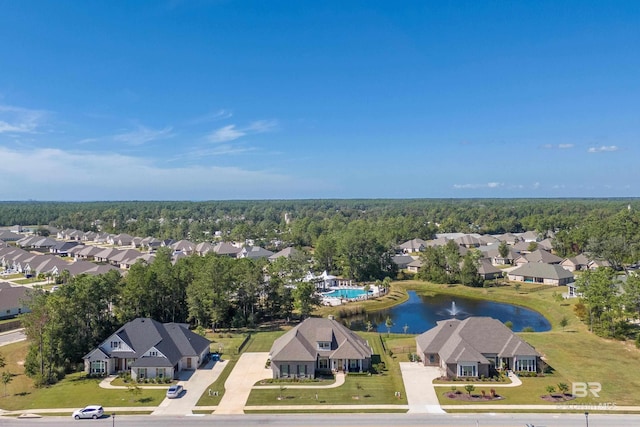 drone / aerial view with a water view and a residential view