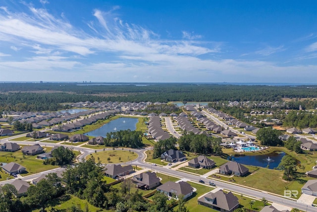 bird's eye view featuring a residential view, a water view, and a view of trees