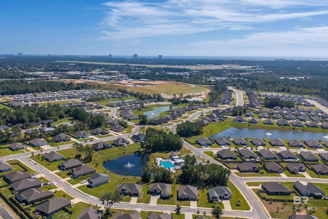 bird's eye view featuring a water view and a residential view