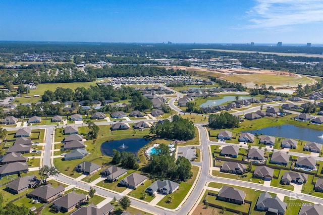 bird's eye view with a residential view and a water view