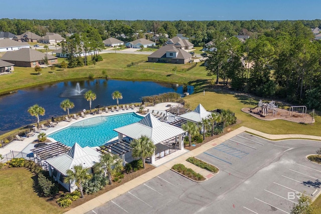 drone / aerial view featuring a residential view and a water view