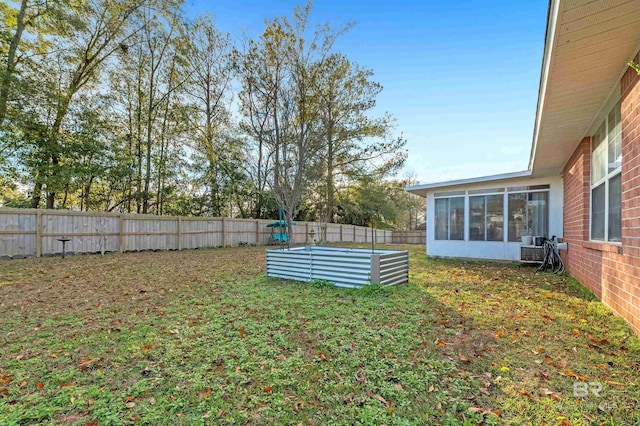 view of yard with a sunroom