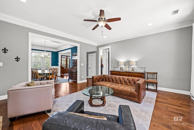 living area featuring wood finished floors, visible vents, and baseboards