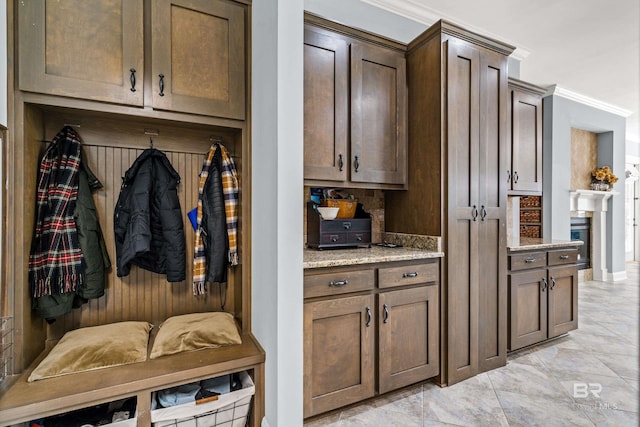 mudroom featuring a fireplace