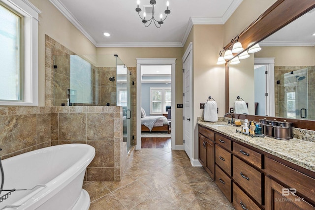 full bathroom with vanity, a soaking tub, a stall shower, ensuite bath, and crown molding