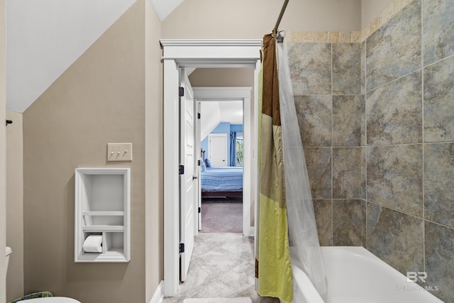 ensuite bathroom with lofted ceiling, toilet, ensuite bath, and shower / bath combo