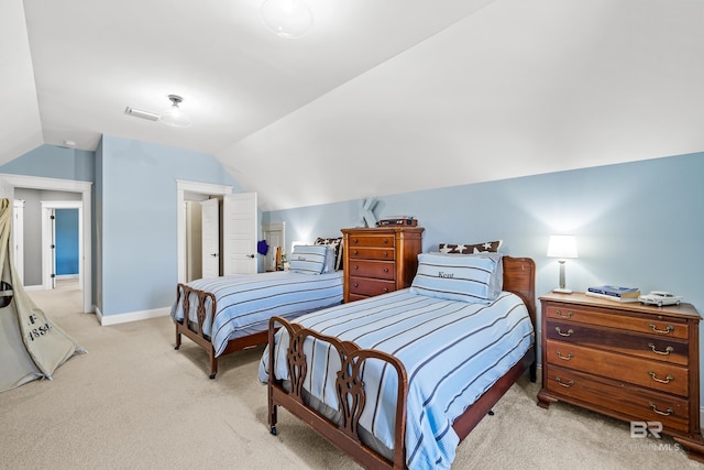 bedroom with light colored carpet, lofted ceiling, visible vents, and baseboards