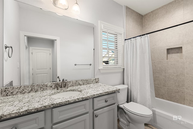 full bathroom with toilet, shower / tub combo, and vanity