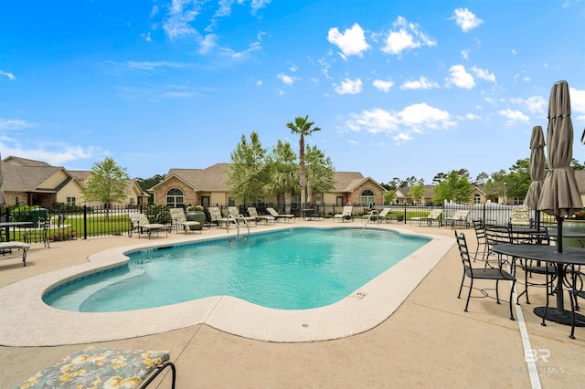 view of swimming pool featuring a patio